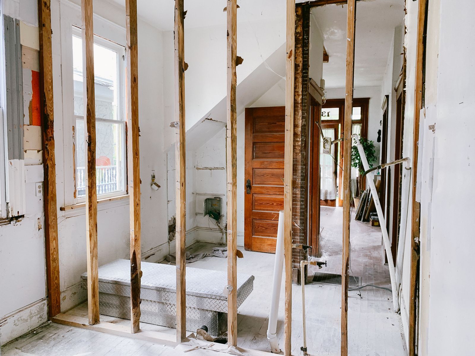 Home interior under renovation with exposed wooden beams